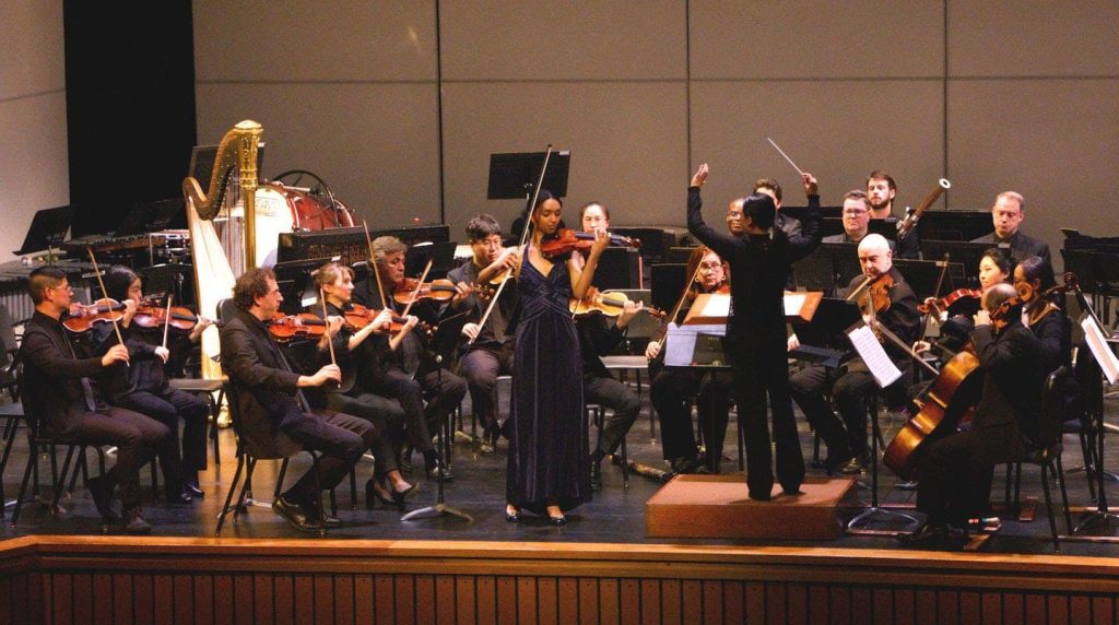 Student Eden Pawlos performs a violin solo with Seattle Symphony Orchestra in October 2024